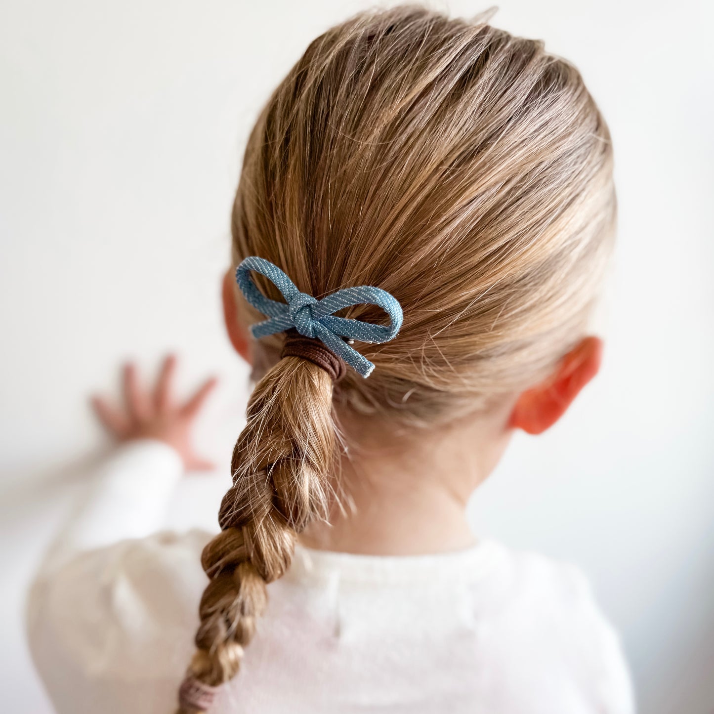 Hand tied denim bow